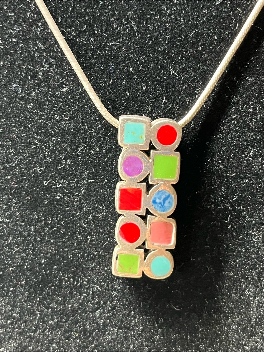 Stunning silver stamped colorful pendant & 19” chain.